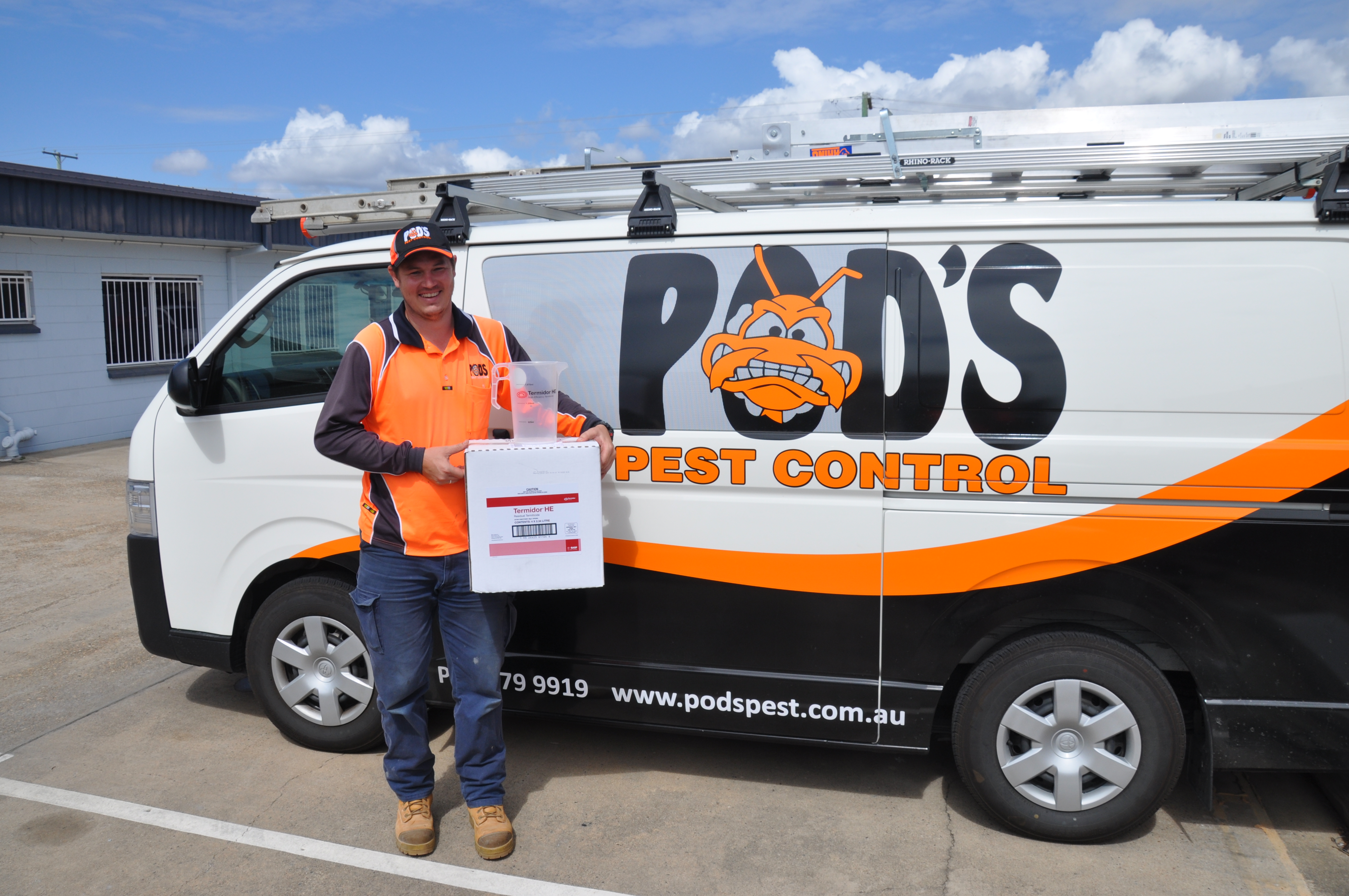 Man in front of pest truck